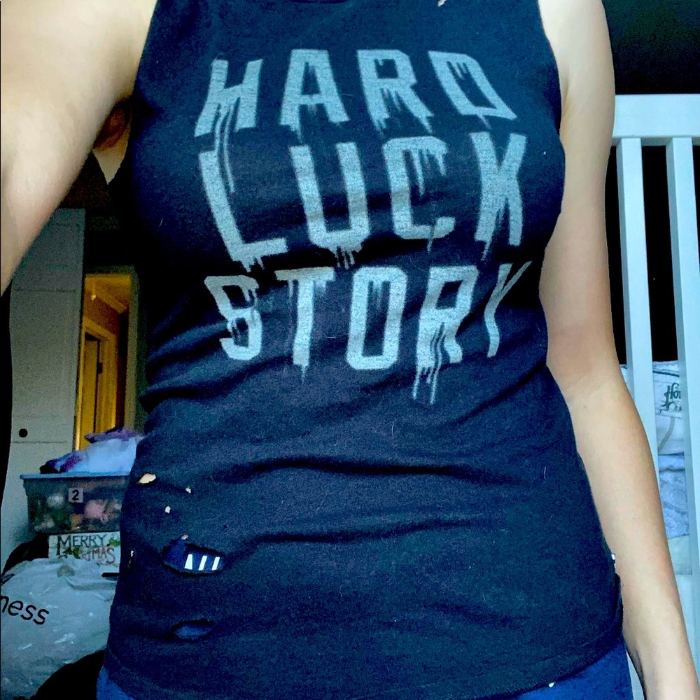 Distressed muscle tee -holes shown are part of the distressing not wear & tear.